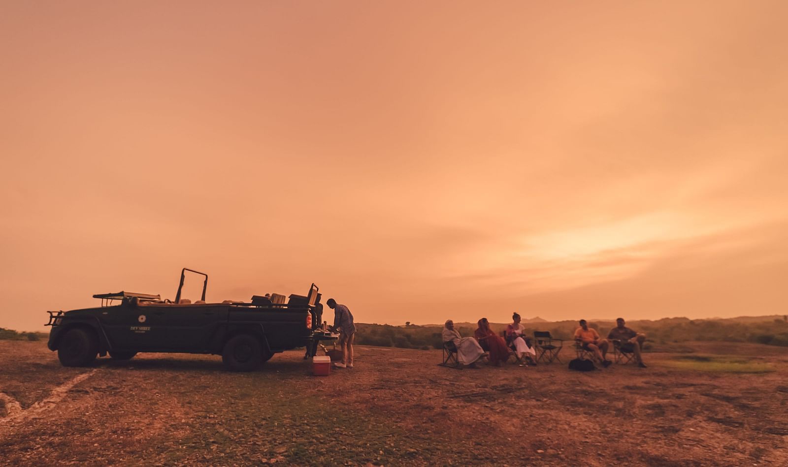 image showing Camping at sunset with pink and orange hues at dev shree, deogarh