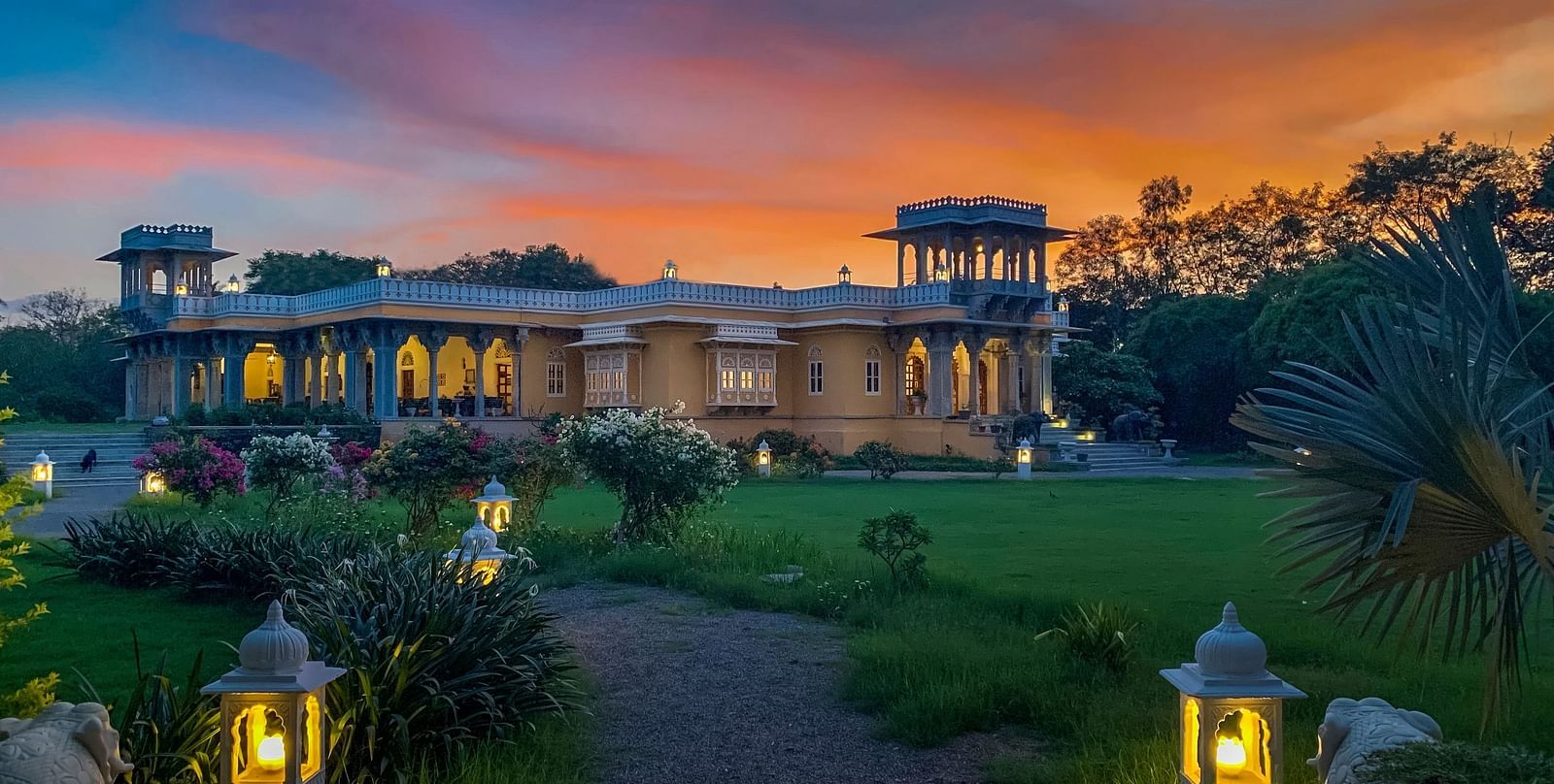 Facade image of Dev Shree, deogarh featuring a beutiful sunset in the background