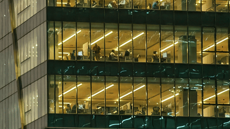Multiple storeys of one of the IT parks in Chennai featuring corporate people at their desks