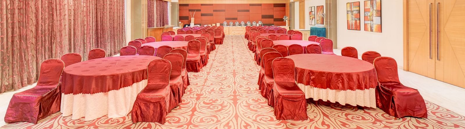 banquet hall with interior design and chairs at The SSK Solitaire Hotel & Banquets, Mumbai Naka - Nashik