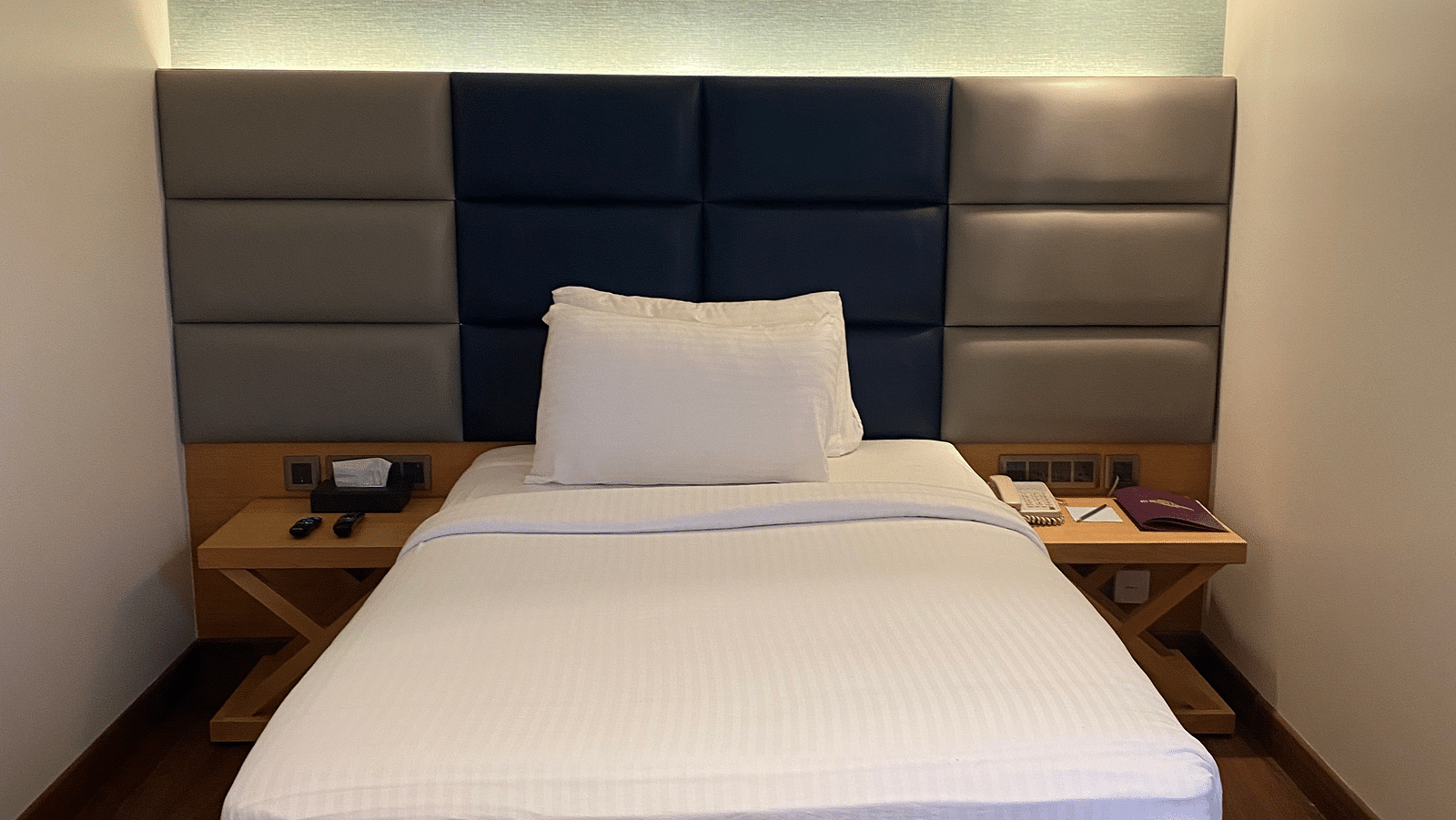 Executive room with plushy bed and calming interior at SRM Hotel Maram Malai Nagar Chennai 