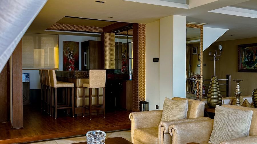 Elegant living room at Aranya Retreat, Mashobra featuring plush seating, warm lighting, and cozy wooden interiors