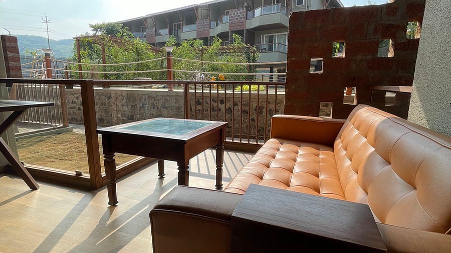 balcony view with sofa and table - Mastiff Grand La Villae Resort, Lonavala