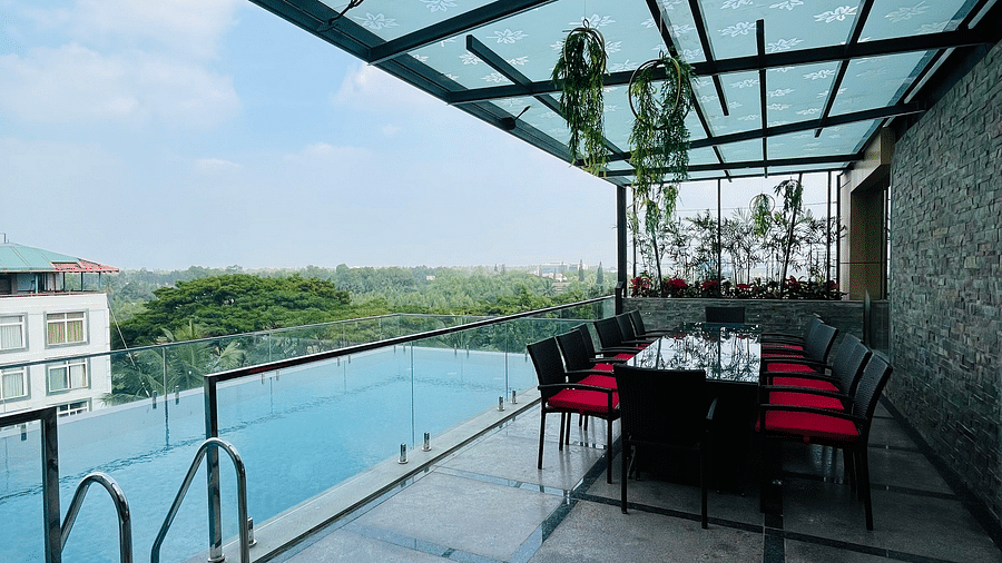 Swimming pool with sitting area on the side-  Quality Inn Rockwell Grand