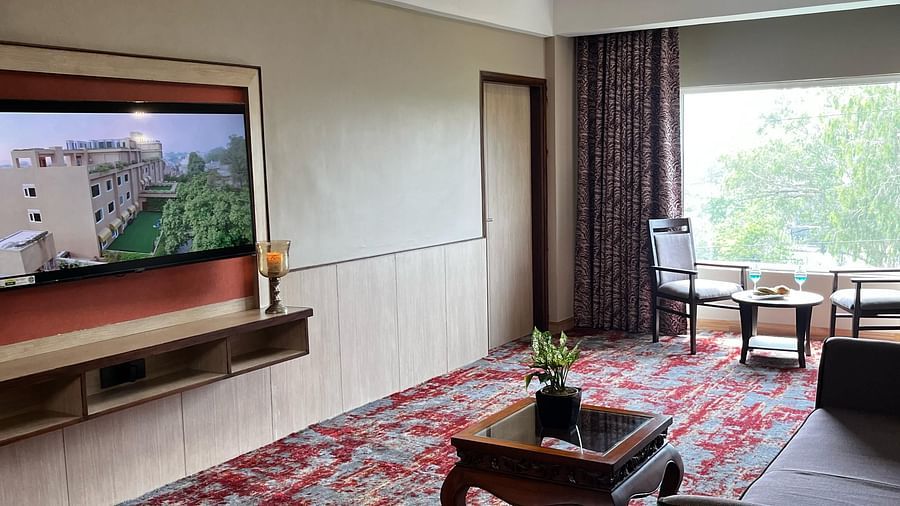 Spacious suite living area with TV at The Lalita Grand
