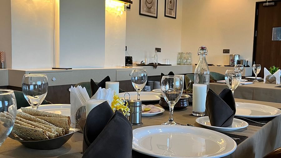 Seating arrangement at aromas restaurant - VITS Jamnagar, Mithoi