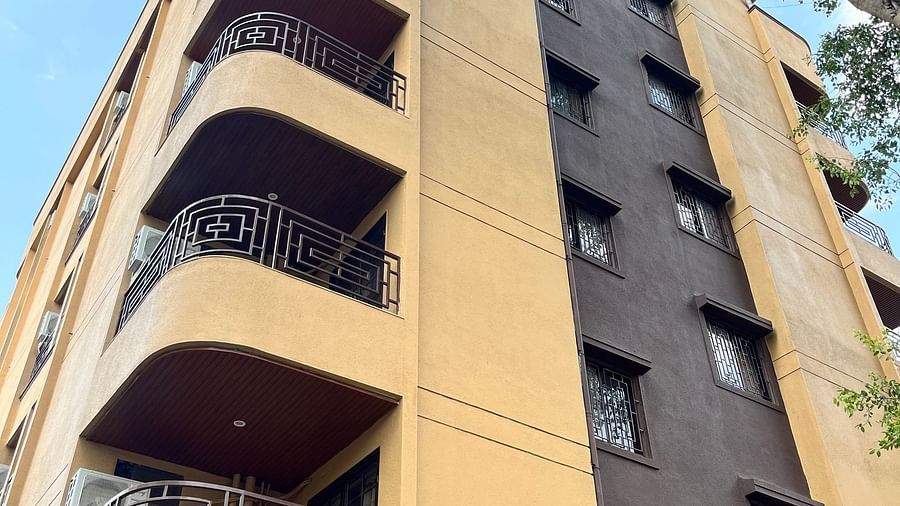 A low angle shot of the hotel building showcasing the balconies in each room at VITS Select Kharadi, Pune.