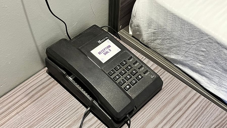 A image showing a land line telephone in the hotel room at VITS Select Kharadi, Pune.