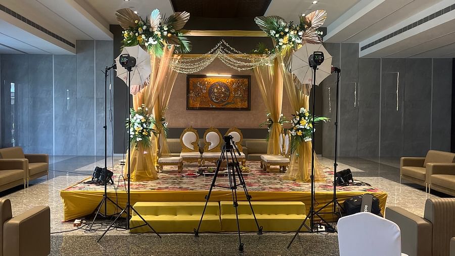 Beautiful wedding stage with floral arch and drapes  | VRR Astoria Hotel and Conventional Centre