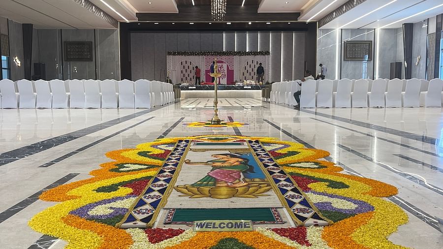 Modern wedding stage with LED lights and floral arrangements  | VRR Astoria Hotel and Conventional Centre
