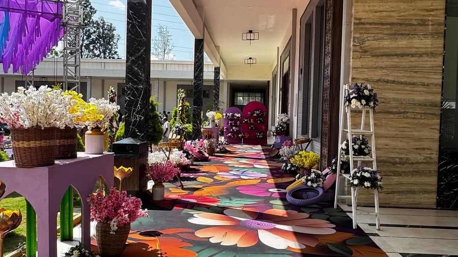 Bright floral pathway leading to the event area at VRR Astoria Hotel and Convention Centre