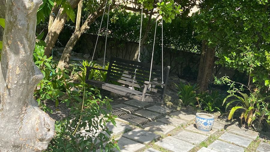 Stone path under trees with a swing | A Stone's Throw Away