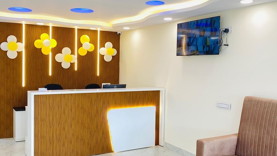 Reception area with stylish lighting and relaxed seating for a warm welcome at Hotel Sahara Tree.