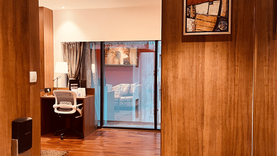 A wide shot of the Superior Smart Suite from the entrance door overlooking the separate living area at the Senses Hotel.