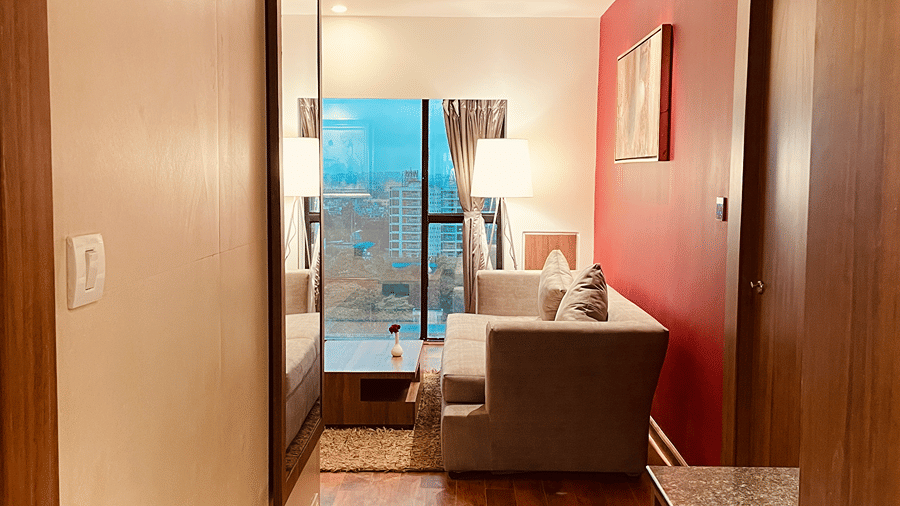 The entrance of the Premier Smart Suite opening into the living room through a passage at the Senses Hotel.