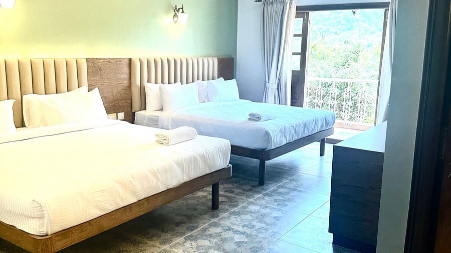 two double beds in one of the Heritage Suites at Summer House, Nandi Hills