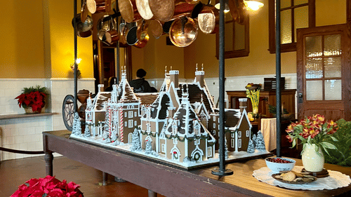 A Gingerbread house placed on a counter