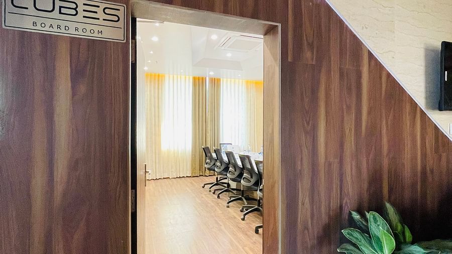entrance to a conference room with wooden exterior and decorated with indoor plants - Quality Inn Rockwell Grand