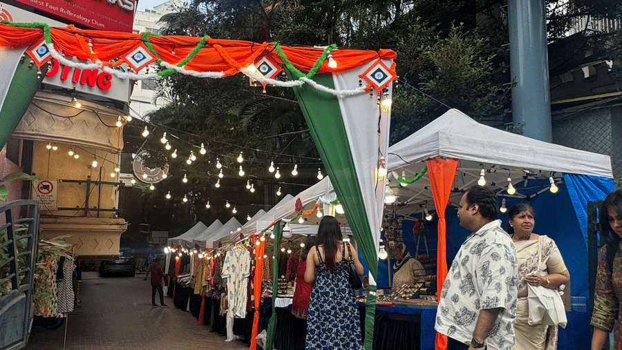 A market place with people looking into different shops. | Monarch Hotels