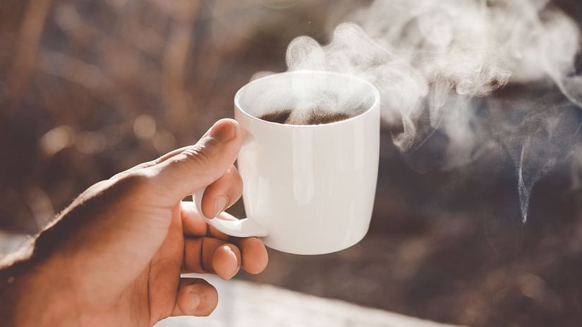 The Birchwood Retreat - image of a person holding a cup of coffee