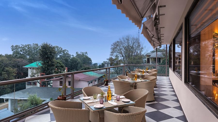 Outdoor dining arrangement at Nutmegg - Infinitea Centric, Dharamshala