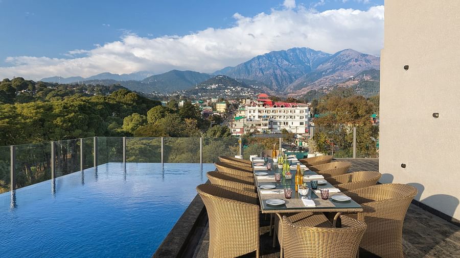 Poolside dining area at Infinitea Centric, Dharamshala