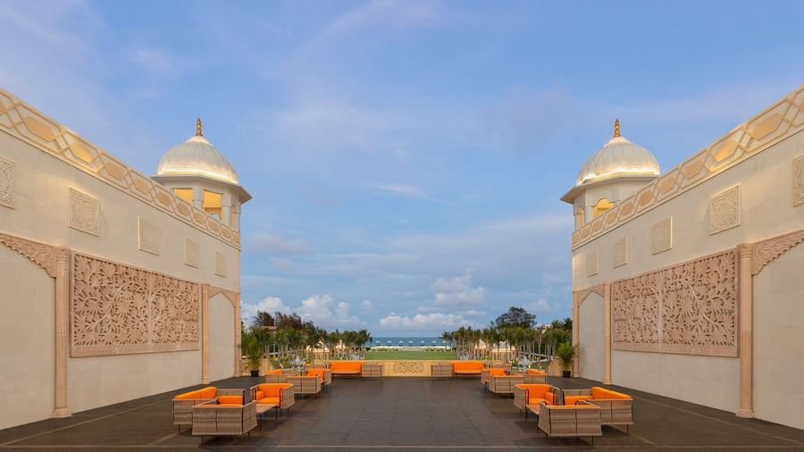 Open-air high tea area with majestic architecture under a serene sky - Kaldan Samudhra Palace