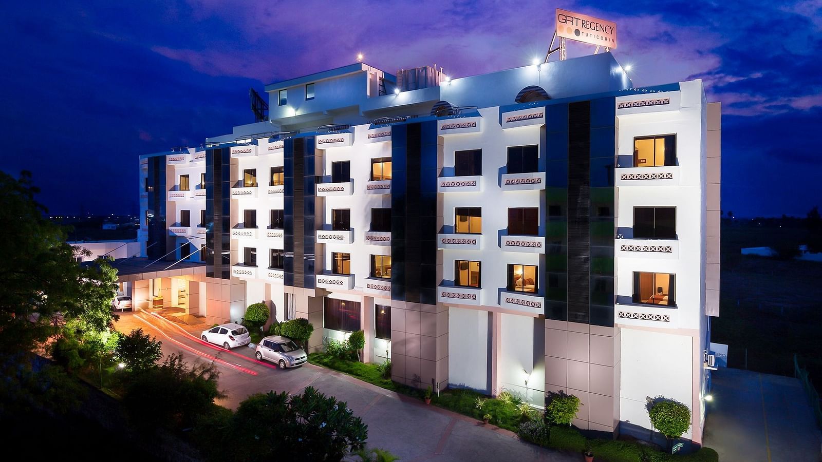 The exterior facade of a hotel building illuminated by warm lights - Regency Tuticorin by GRT Hotels, Best Hotel in Tuticorin