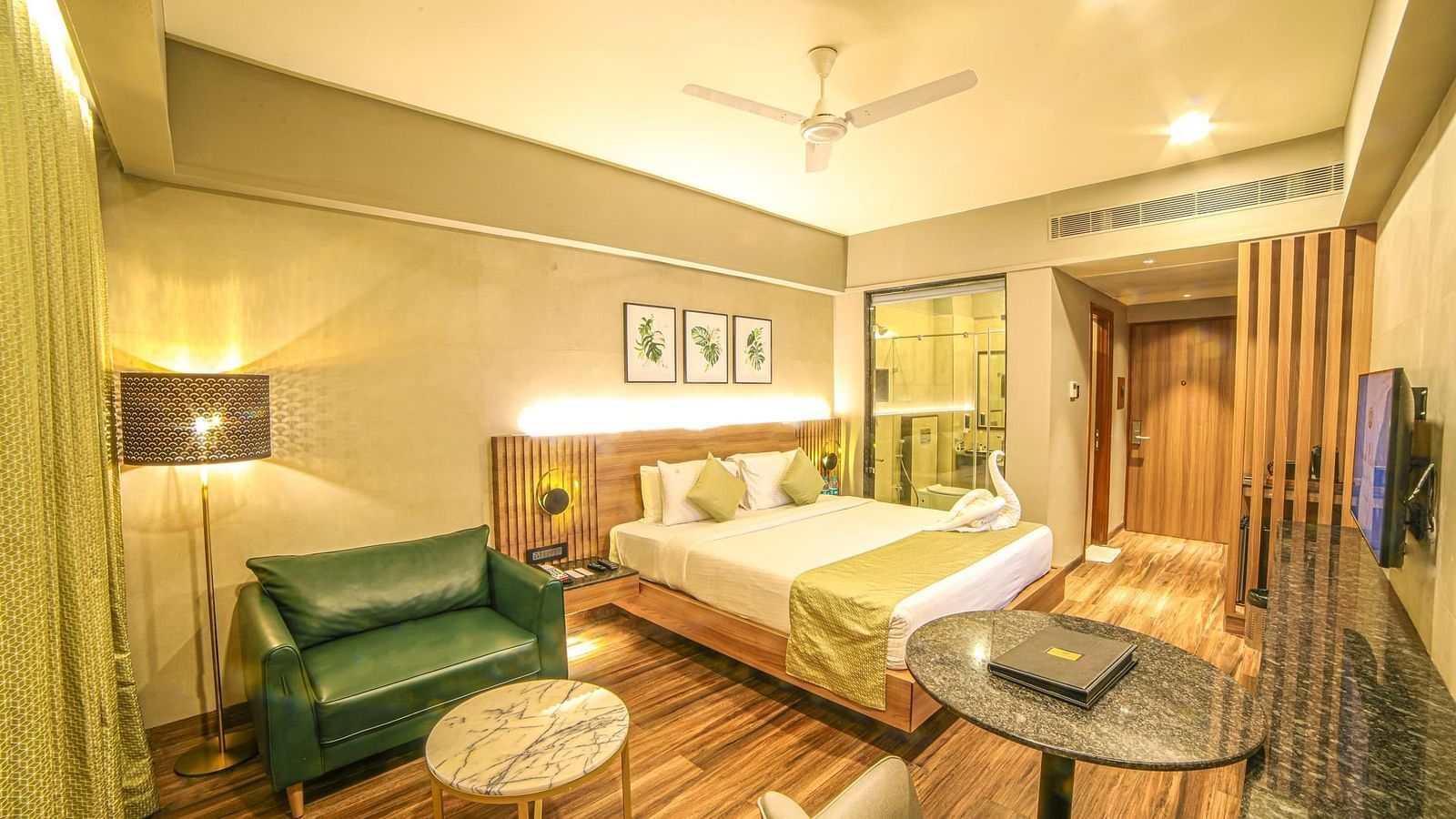 Wide view of the seating and the double bed in Sunrise Room at Grand Palace, Yercaud