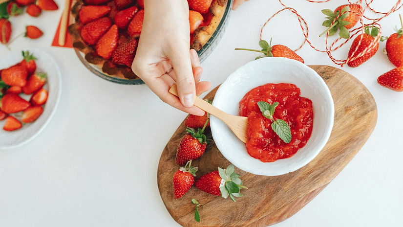 Image of a container with strawberries and a bowl of strawberry jam placed on a table - The Dukes Retreat, Khandala