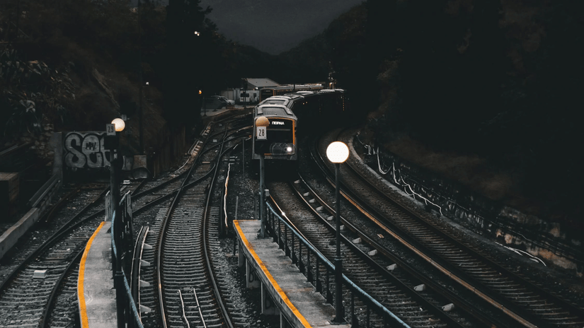 An overview of railway tracks with a train running on it - How to Reach Lonavala by Train