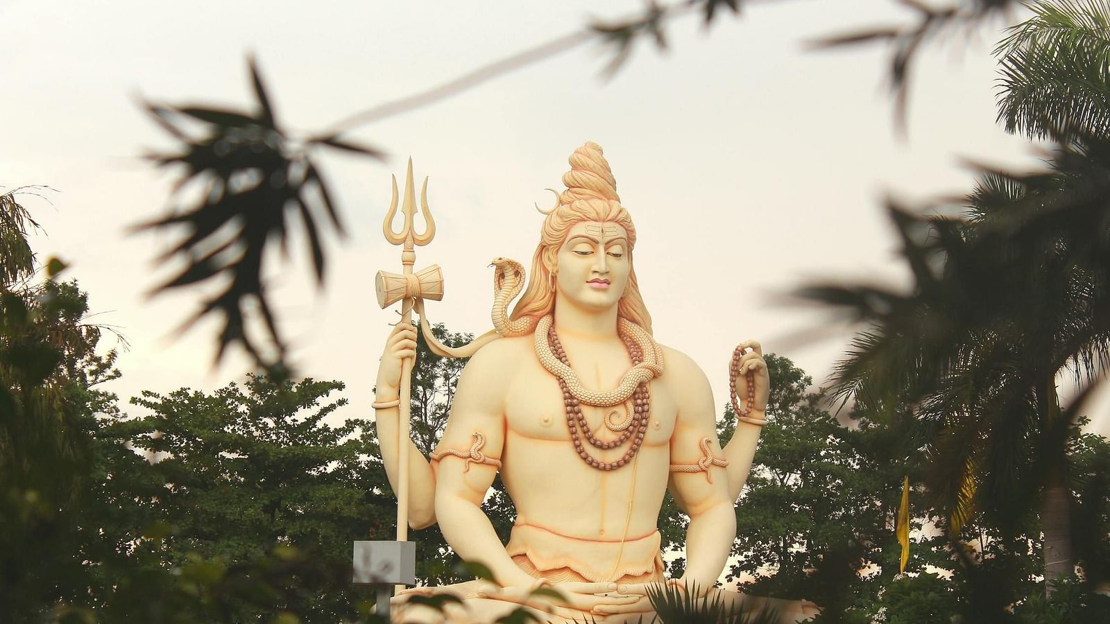 Image of lord Shiva statue surrounded by trees | Faraway Cottages, Auli