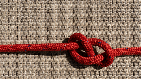 Top view of a rope tied in a knot.