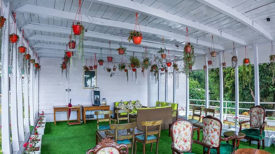 Open-air dining arrangement at Summit Barsana Resort & Spa, Kalimpong