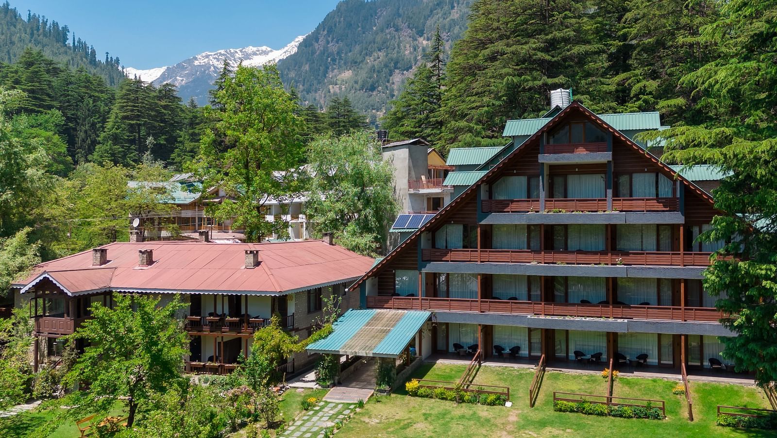 A facade image of Bedzzz Xclusiv Baikunth, Manali in an attic style during a bright sunny day