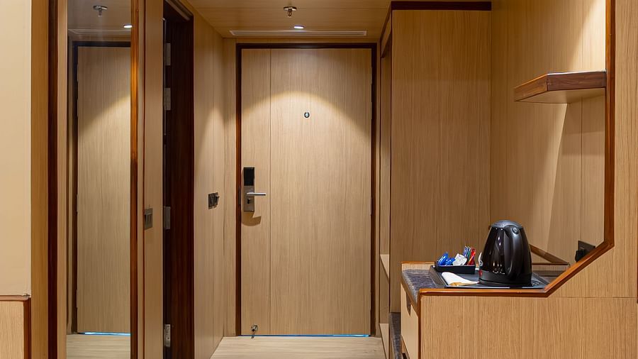 Hotel room entrance and hallway at The Lalita Grand.
