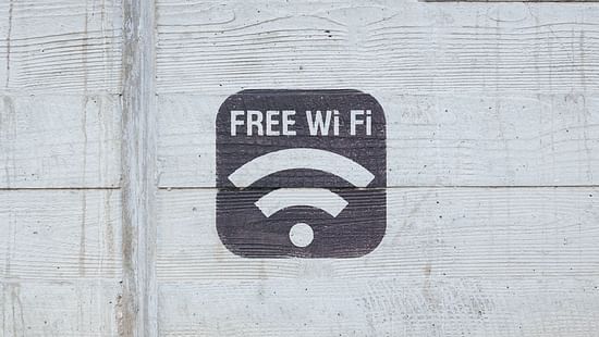 The Wi-Fi symbol painted on a wall - Stone Wood Riverfront Resort, Siolim