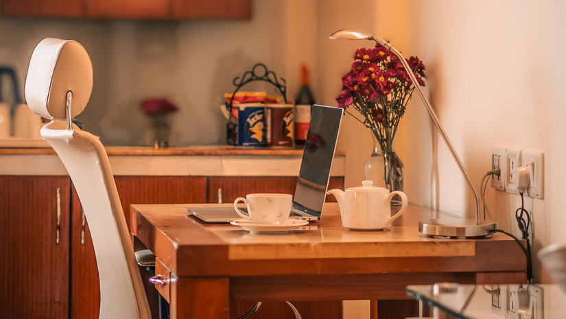 Work desk with a chair in the luxury suite at The Suryaa New Delhi
