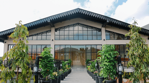 View of Mausmai Ballroom with a grid-structured glass façade, flooding the space with natural light and offering stunning outdoor views