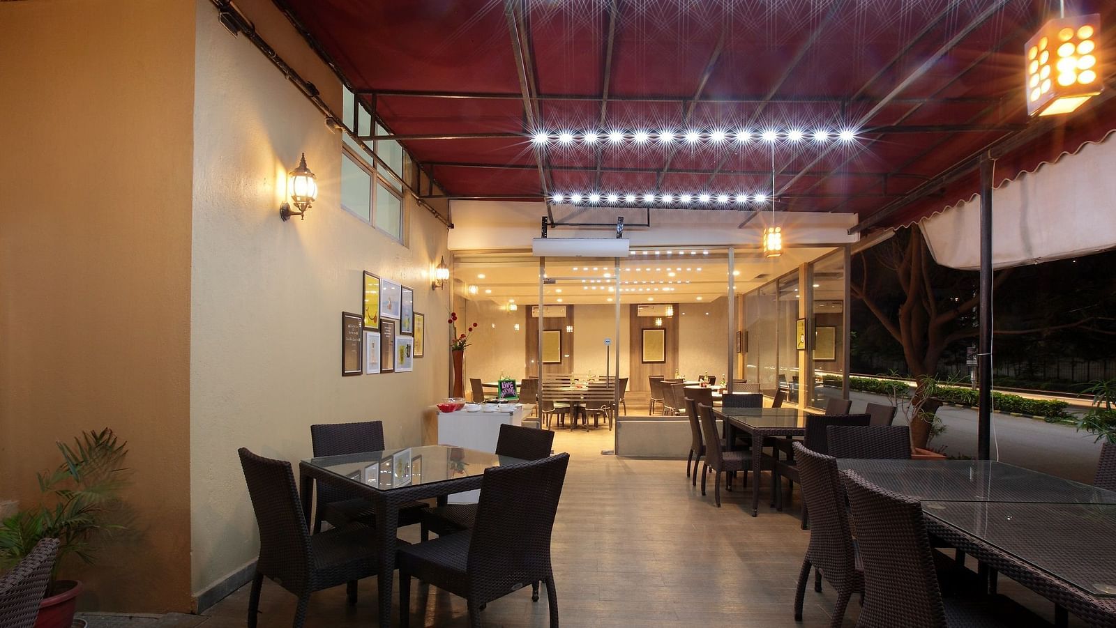 Seating arrangement in the restaurant at Starlit Suites, Bangalore