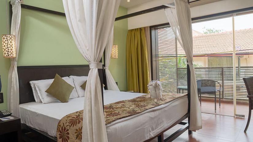 View of a king size bed in the Superior room at Kyriad Prestige Calangute, Goa