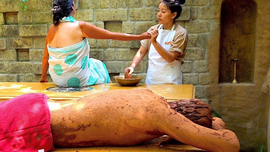 a man resting after a mud therapy session