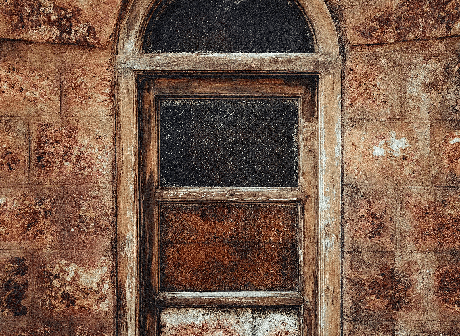 A vintage motel window on an old wall.