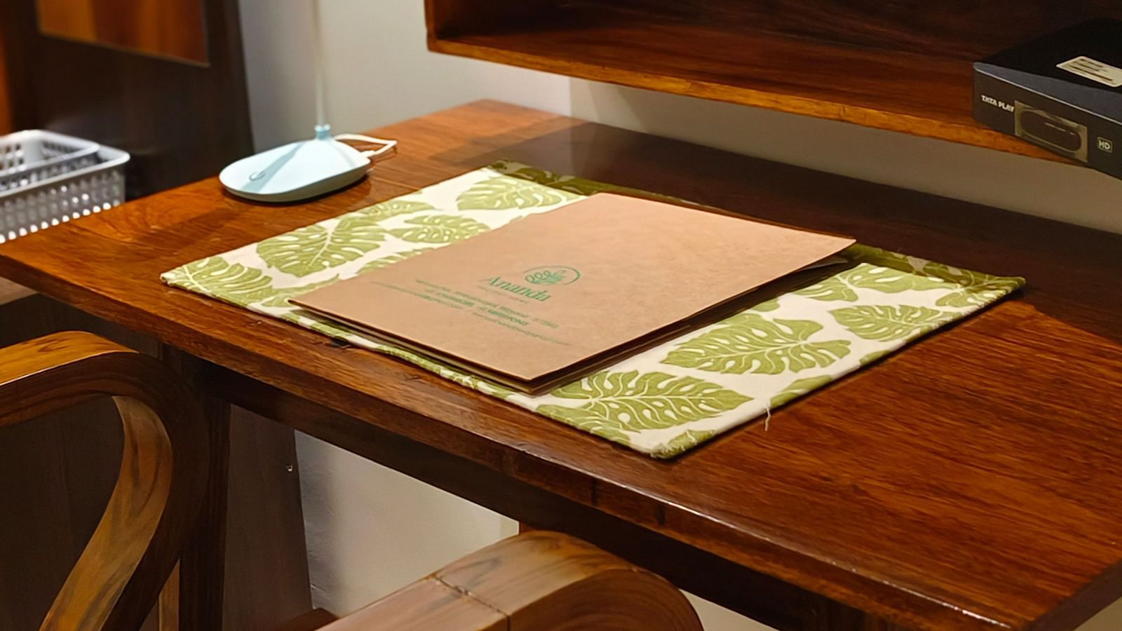 Close view of a study table and a chair in 101 non-ac room at Ananda Holiday Home, Wayanad 2