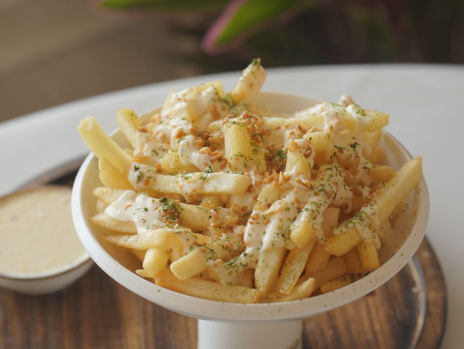 Crispy French fries served in a silver bowl with dipping sauces - Mayfair Cafe & Suites, Dalhousie