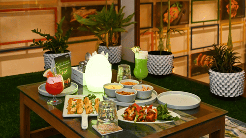 a table with many food items and fruits kept on it inside MEZZE9 Bar Kitchen 16 - VITS Sharanam, Thane