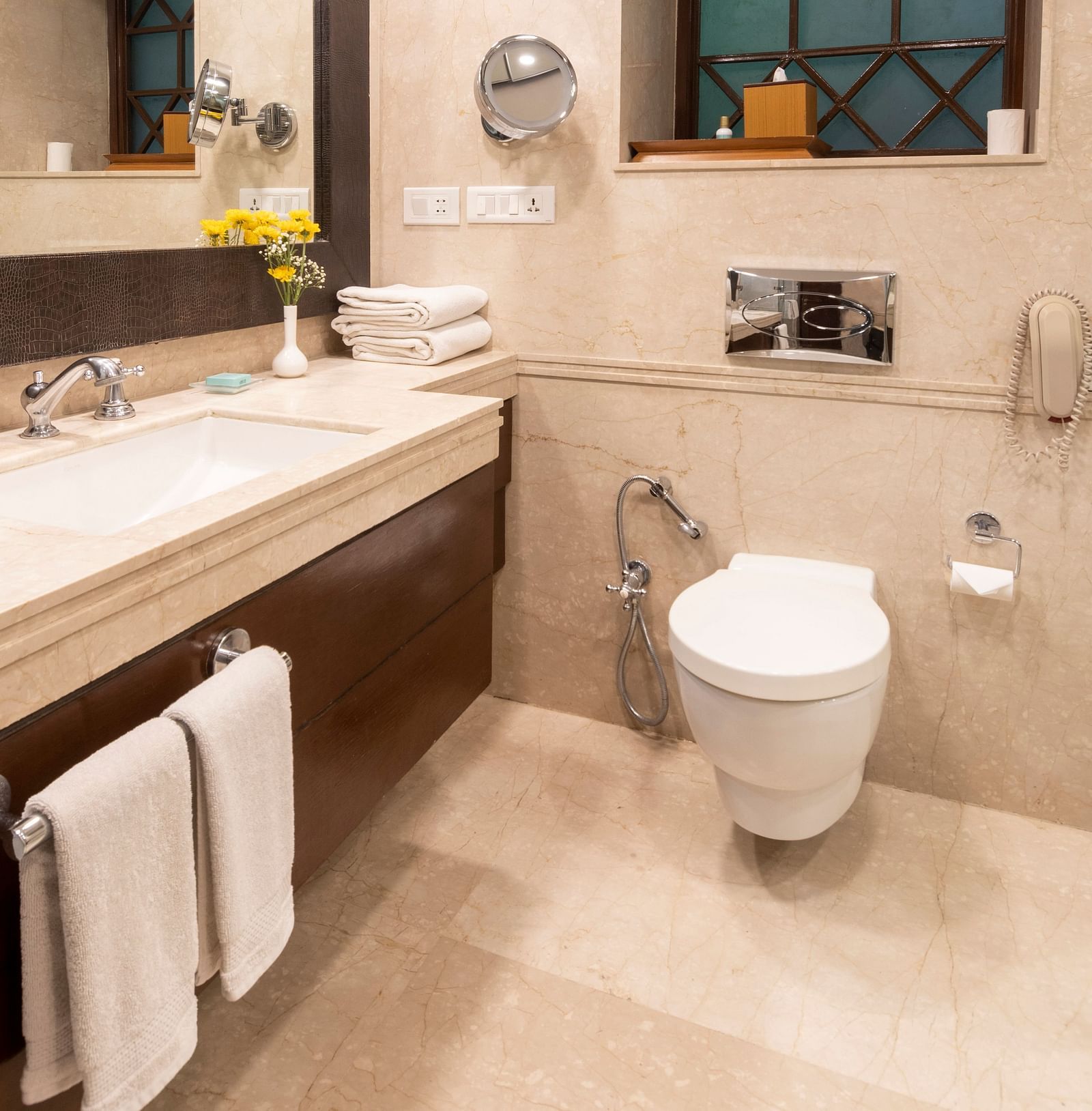 image of a bathroom filled with modern amenities at the The Claridges Nabha Residence