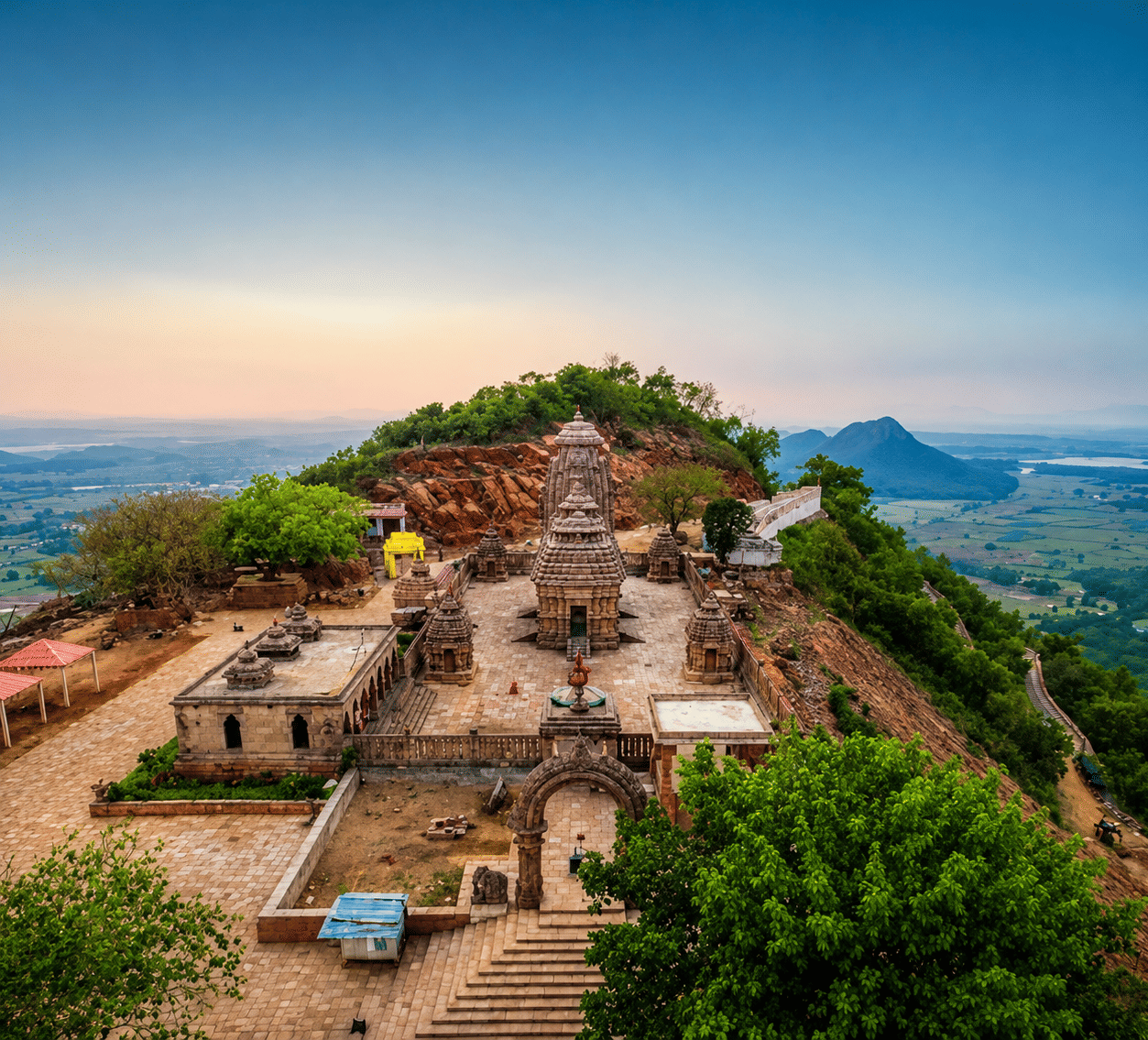 Tara Tarini hilltop temple complex with stone shrines, a paved courtyard and surrounding plains, near MAYFAIR Palm Beach Resort, Gopalpur-on-Sea.