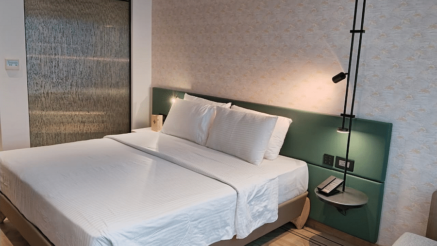 A king size bed in the Deluxe Room at Regency Hotel, Mumbai.
