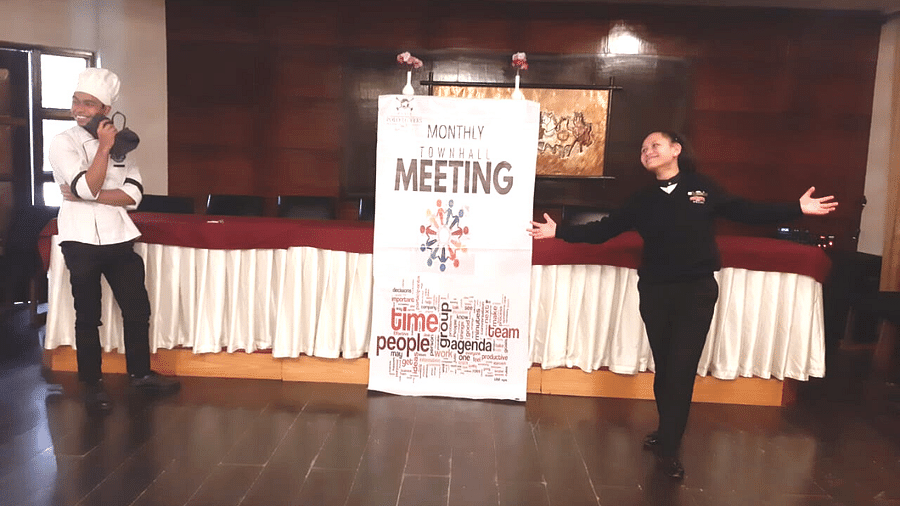 people posing at a meeting
